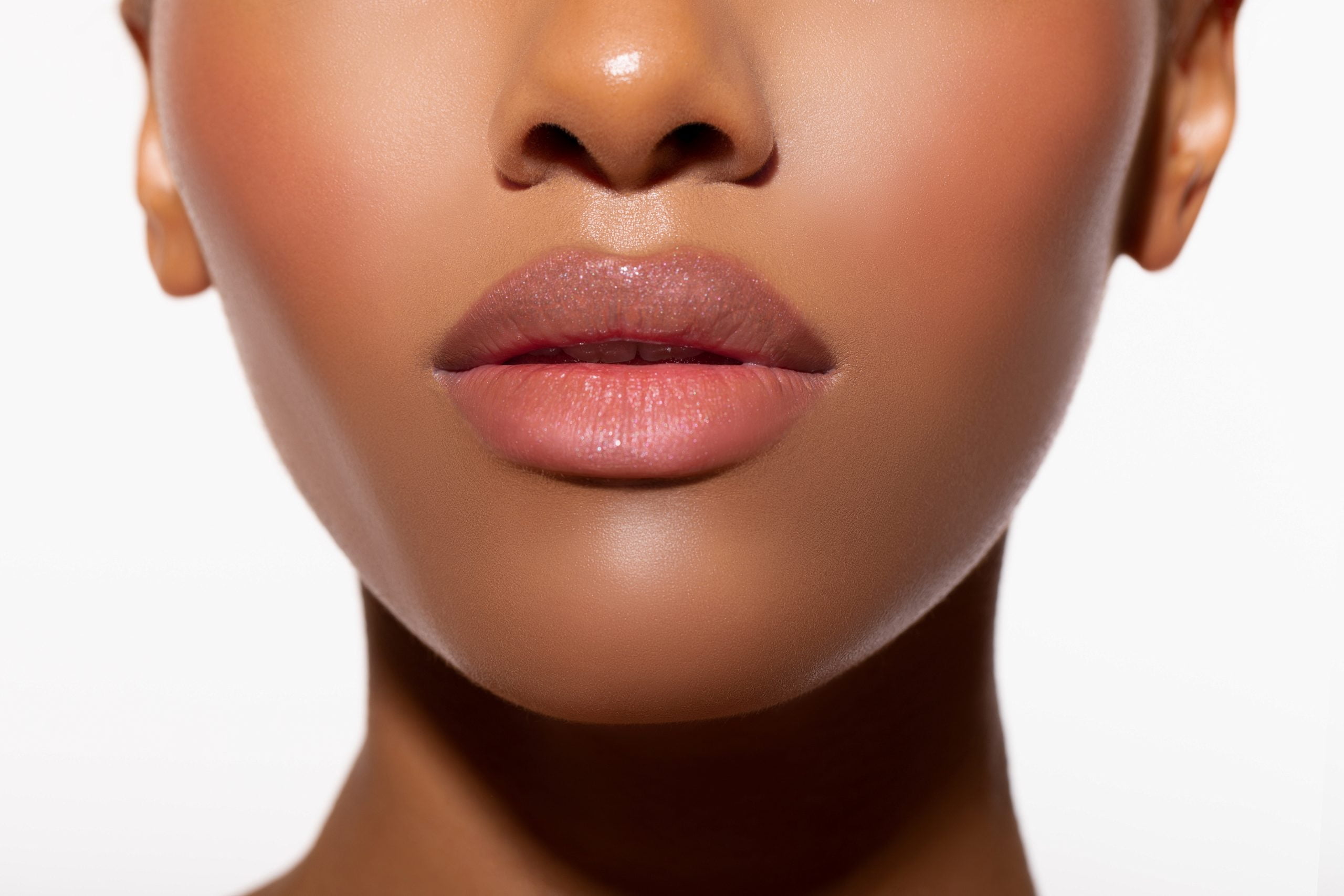 Beautiful lips Close-up. Makeup. Fashionable portrait girl in neon light background. Portrait of beautiful black woman. Sexy bodily Lips close up.